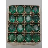 A 9ct Emerald Silver Ring. Sixteen oval-cut emeralds positioned in a square setting. Size V. 27.35g