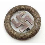 A Vintage German 1933 Brass/Bronze Party Badge back stamped Deschler and Sohn Munich.