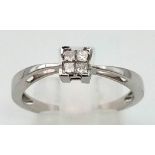 A 9 K white gold ring with four diamonds (total o.25 carats). size: Q, weight: 2.1 g.