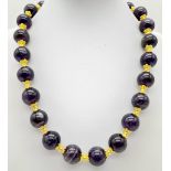 A Purple Stone, Possibly Amethyst Beaded Necklace. Gilded spacers and clasp. 42cm