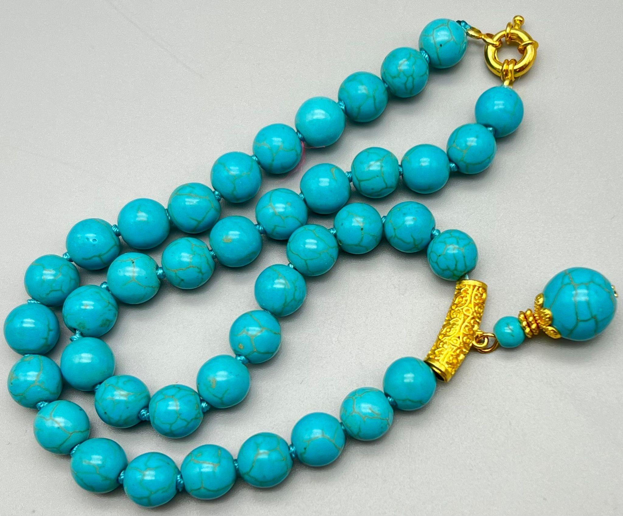 A Turquoise Bead and Pendant Necklace. Gilded decoration. 42 and 3cm. Largest bead 14mm - Bild 2 aus 3