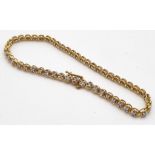 A Compton and Woodhouse 9K Yellow Gold Diamond Tennis Bracelet. 0.5ct diamond weight. 5.74g total
