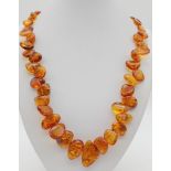 A Vintage Natural Amber Beaded Necklace. Irregular shapes. Light as a feather. UV light tested. 38.