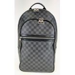 A Louis Vuitton Checked Canvas and Leather Back Pack. Three outer zipped pockets. Excellent