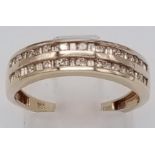 A 9K Yellow Gold Diamond Double-Row Half-Eternity Ring. Alternating round-cut and baguette diamonds.