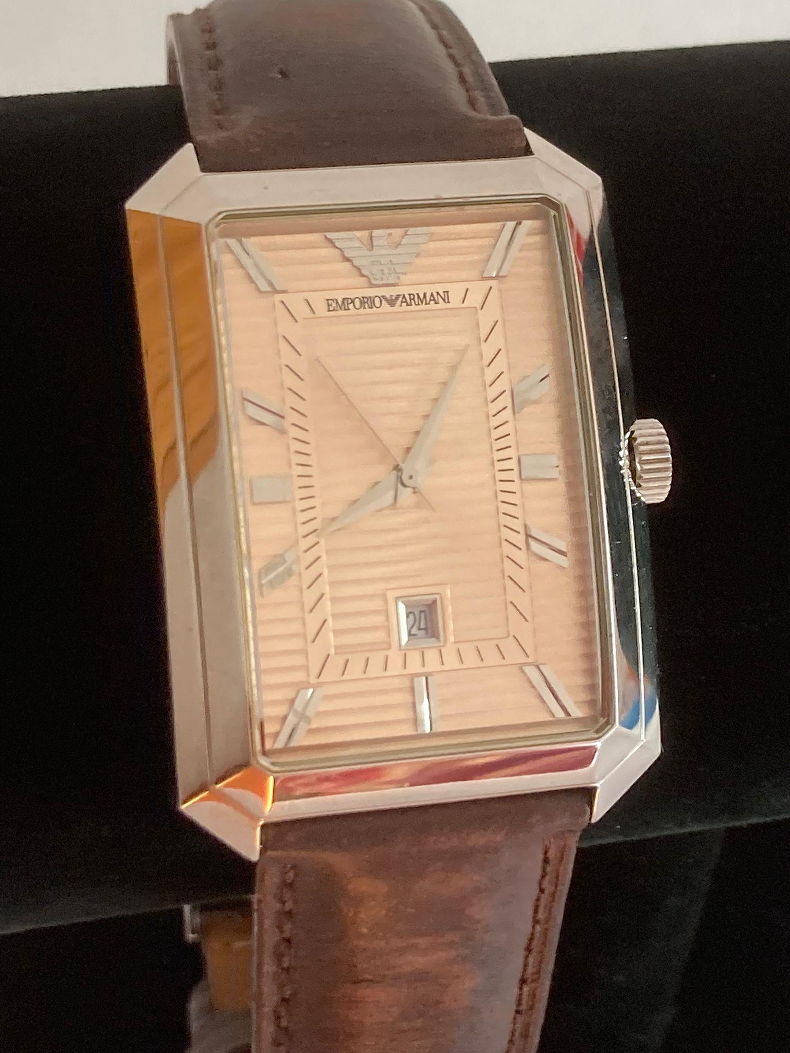 Gentlemans ARMANI quartz wristwatch with the ARMANI Signature design large square lined face with