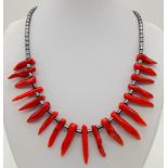 A Rough Red Coral and White Metal Necklace. 40cm