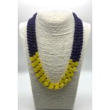 A Dazzling Three-Strand Amethyst and Yellow Onyx Beaded Necklace. Round and oval beads. 46 - 52cm.