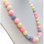 A Multi-Colour Jade Bead Necklace. 12mm beads. 42cm. Colour enhanced