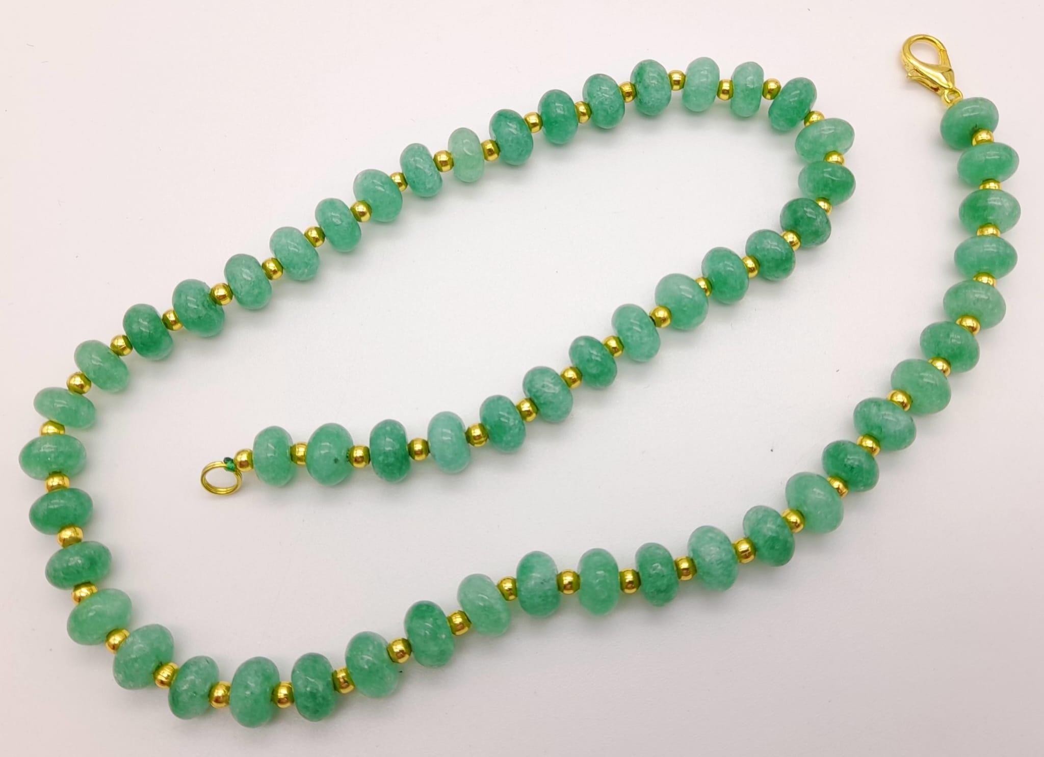 An Emerald Bead Necklace. Gilded spacers and clasp. 44cm. - Image 2 of 3