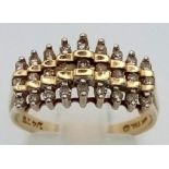 An unusual 10 K yellow gold ring with three diamond rows (0.20 carats). Ring size: N, weight: 3 g.