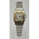 A LADIES GOLD AND STEEL CARTIER WRISTWATCH WITH QUARTZ MOVEMENT. 24mm