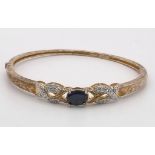 STERLING SILVER WITH GOLD TONE DIAMOND AND BLUE STONE BANGLE 12.6G