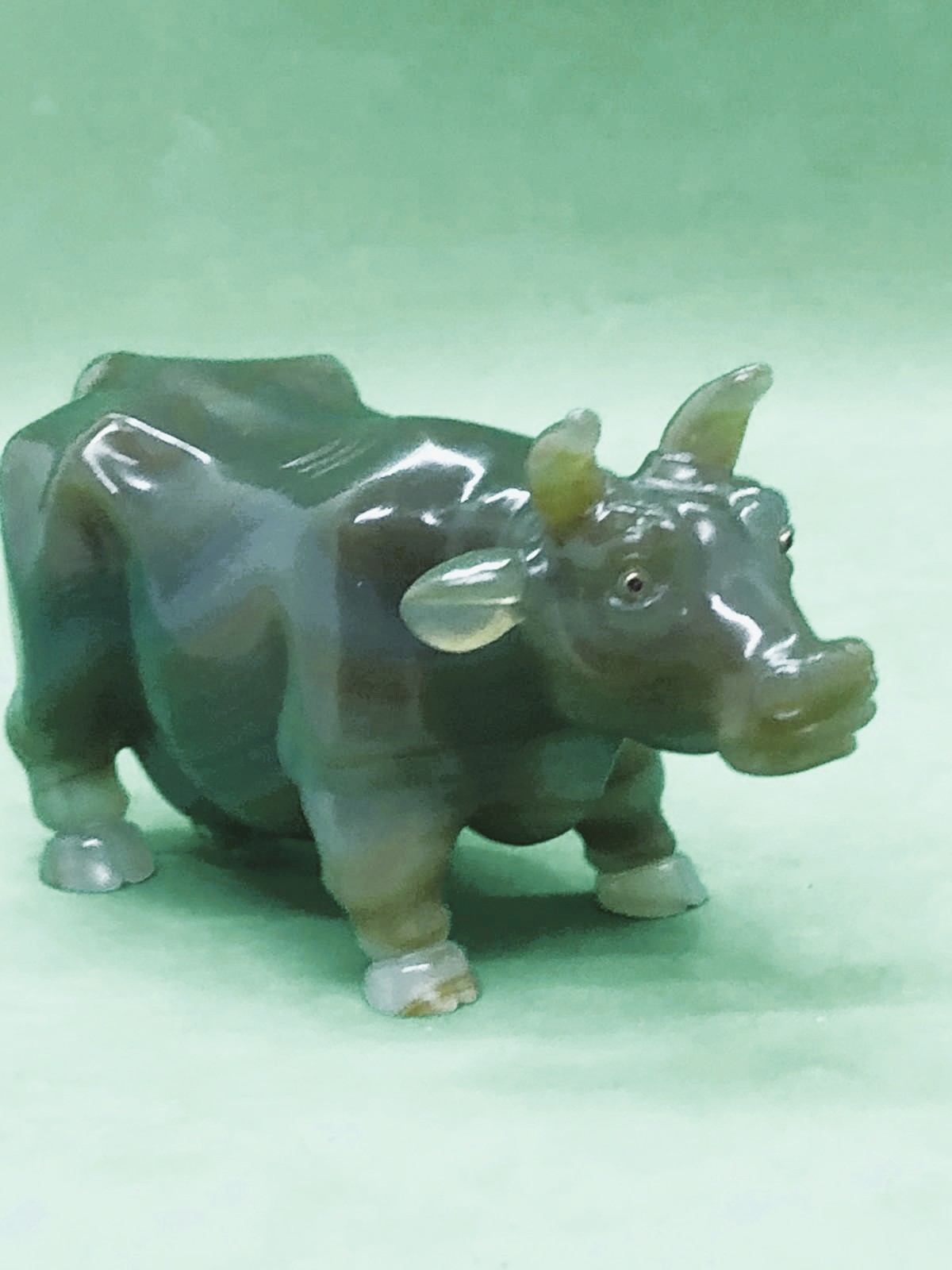 A Russian early carved agate cow/bull figure set with gold and ruby eyes Width 10.5cm Height to