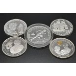 Five Assorted Uncirculated Sterling Silver Coins.