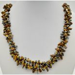 A Three Strand Rough Tigers Eye Bead Necklace. 60cm.