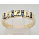 A 9 K yellow gold ring with sapphires and diamonds. Size: N, weight: 2.9 g.