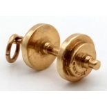 An unusual, 9 K yellow gold dumbbell charm. length: 23 mm, weight: 4.7 g.