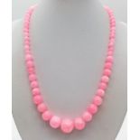 A Pink Jade Graduated Bead Necklace. Largest bead 14mm. 44cm. Colour enhanced