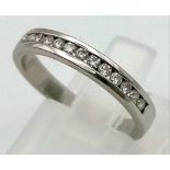 A 950 Platinum Diamond Half Eternity Ring. 15 small diamonds. Size L. 3.7g total weight. Ref: 0059