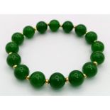 A Green Jade Bead Expandable Bracelet.