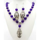 A white mental (untested), Thai Buddhist, dark lavender jade necklace and earrings set with Buddha