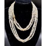 3 ROWS OF NATURAL SOUTH SEA PEARLS WITH TWO 14K GOLD CATCHES , TRANSFORMS INTO A 6 ROW CHOKER