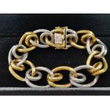 A Very Unique 18K Yellow and White Gold W.G.I. Certified Bracelet. Barbed-wire effect links. 100.88g