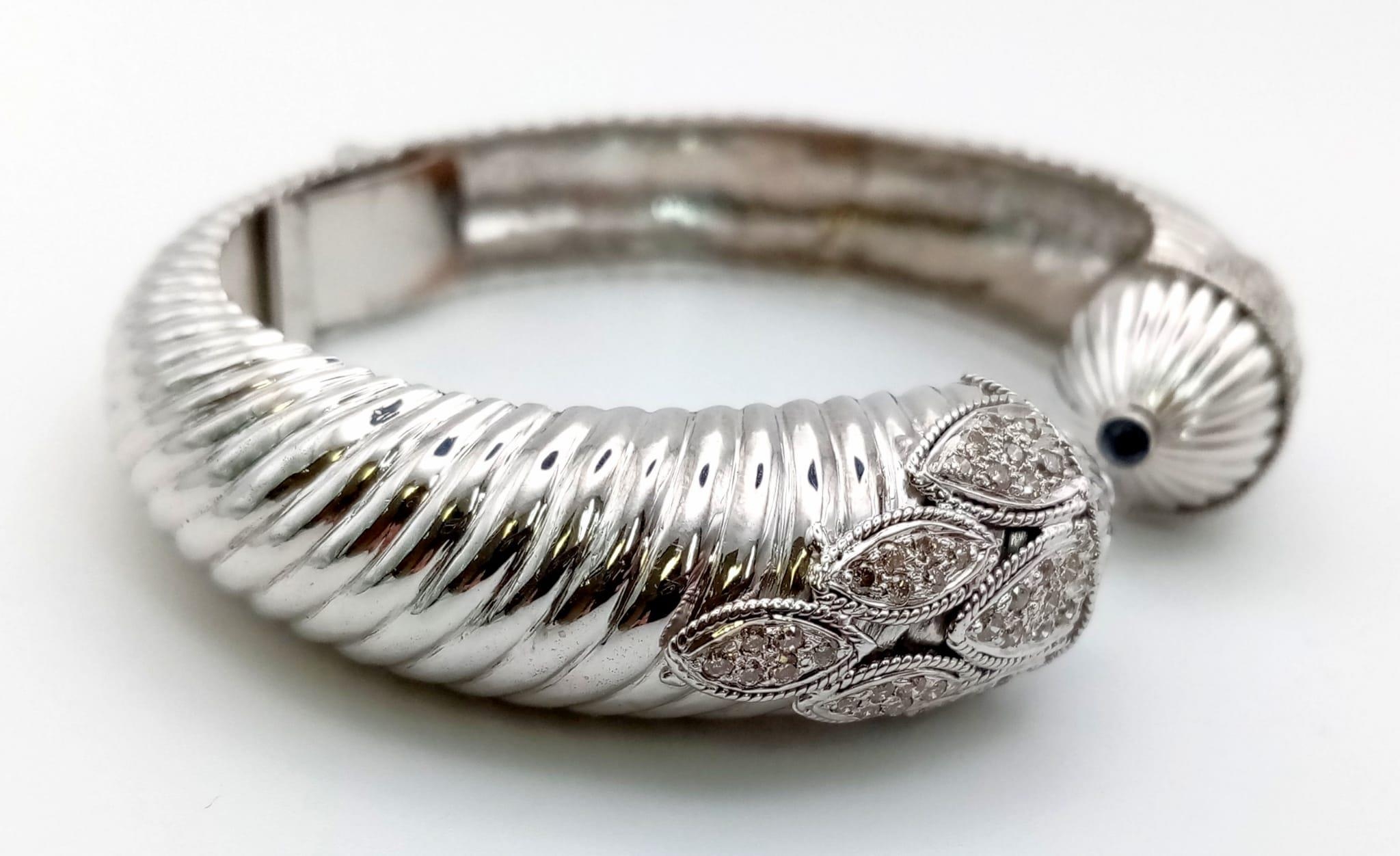 A 14K WHITE GOLD HINGED DIAMOND BANGLE WITH SAPPHIRE TIPS , BEAUTIFULLY SHAPED AND DESIGNED. 39.6gms - Bild 3 aus 4