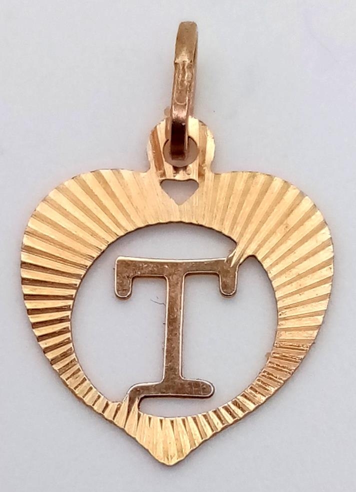 A Small 9K Yellow Gold Letter T Pendant.