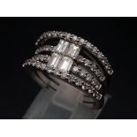 This is the ultimate in a cocktail stacking ring, it is designed with natural diamond baguettes in