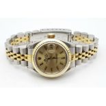 A LADIES ROLEX OYSTER PERPETUAL DATEJUST IN BI-METAL WITH GOLDTONE FACE. 26MM