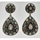 A Pair of Vintage Silver and Diamond Earrings. 15mm diameter wheel leads to a large teardrop of