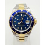 A ROLEX SUB-MARINER IN BI-METAL WITH BLUE BEZEL AND FACE AND IN GOOD ORDER THROUGHOUT. 40mm