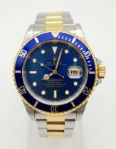 A ROLEX SUB-MARINER IN BI-METAL WITH BLUE BEZEL AND FACE AND IN GOOD ORDER THROUGHOUT. 40mm
