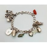 A sterling silver bracelet with eleven charms. Weight: 28.7 g.