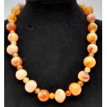 A Carnelian and Agate Bead Necklace. 5 and 12mm beads. 40cm