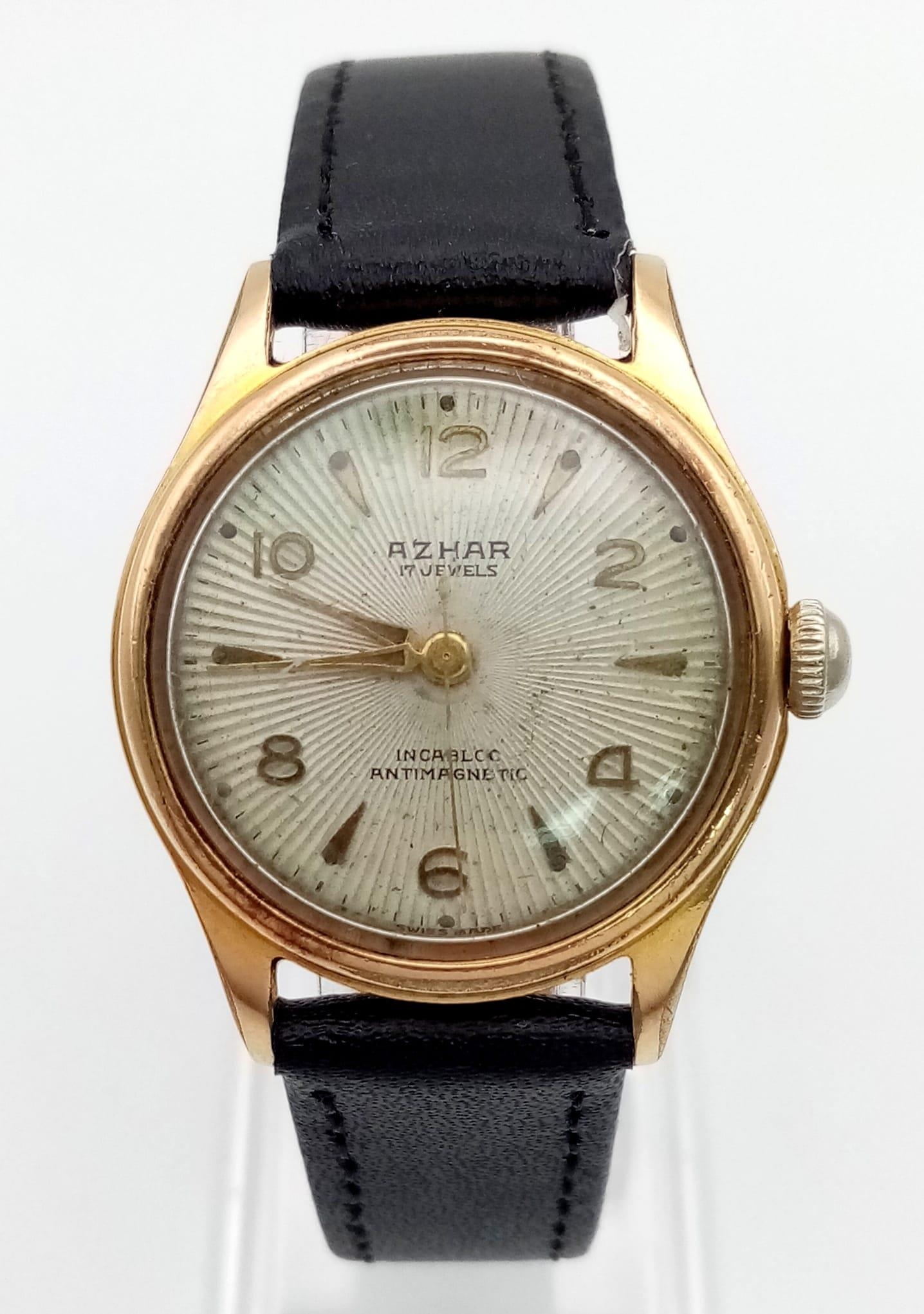 A Vintage Azhar Mechanical Watch. Black leather strap. Case - 30mm. In working order.