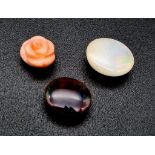 Lot of 3 Gemstones - 3.80 Ct White Fire Opal, 3.50 Ct Black Fire Opal & 3.50 Ct Carved Pink Coral,