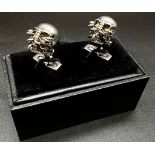 An Iconic ALEXANDER MCQUEEN sculls pair of cufflinks. In excellent condition with original travel
