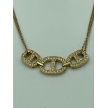 MICHAEL KORS NECKLACE in gold tone with double strands and jewelled trilogy pendant . Having Michael