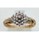 A 9 K yellow gold ring with diamonds (0.25 carats) on top cluster and shoulders. Size: M, weight: