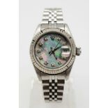 A LADIES ROLEX OYSTER PERPETUAL DATEJUST IN STAINLES STEEL WITH MOTHER OF PEARL DIAL, DIAMOND