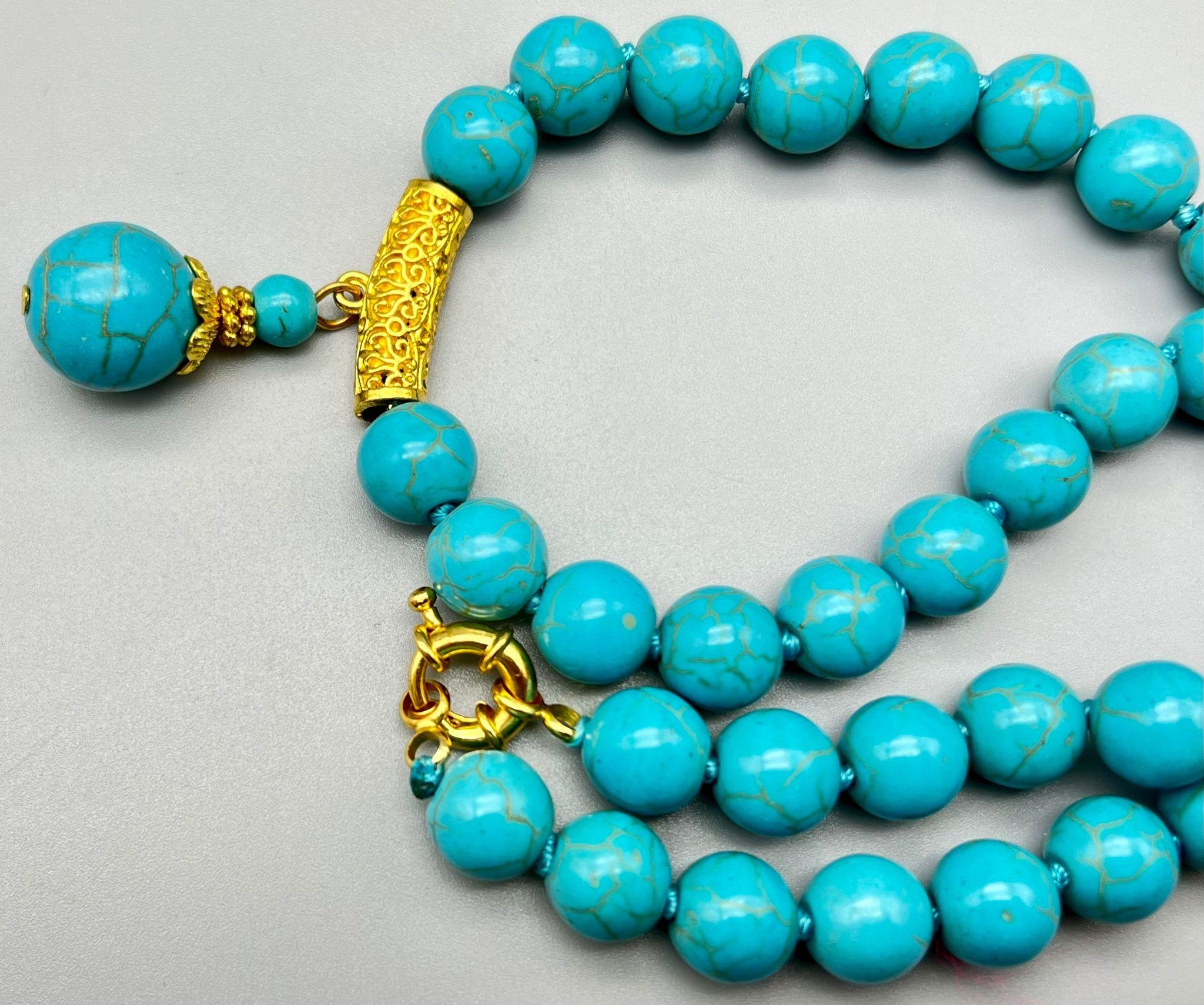 A Turquoise Bead and Pendant Necklace. Gilded decoration. 42 and 3cm. Largest bead 14mm - Image 3 of 3