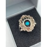 SILVER NATIVE AMERICAN RING from NAVAJO designer Richard Begay. Unusual baroque style with turquoise