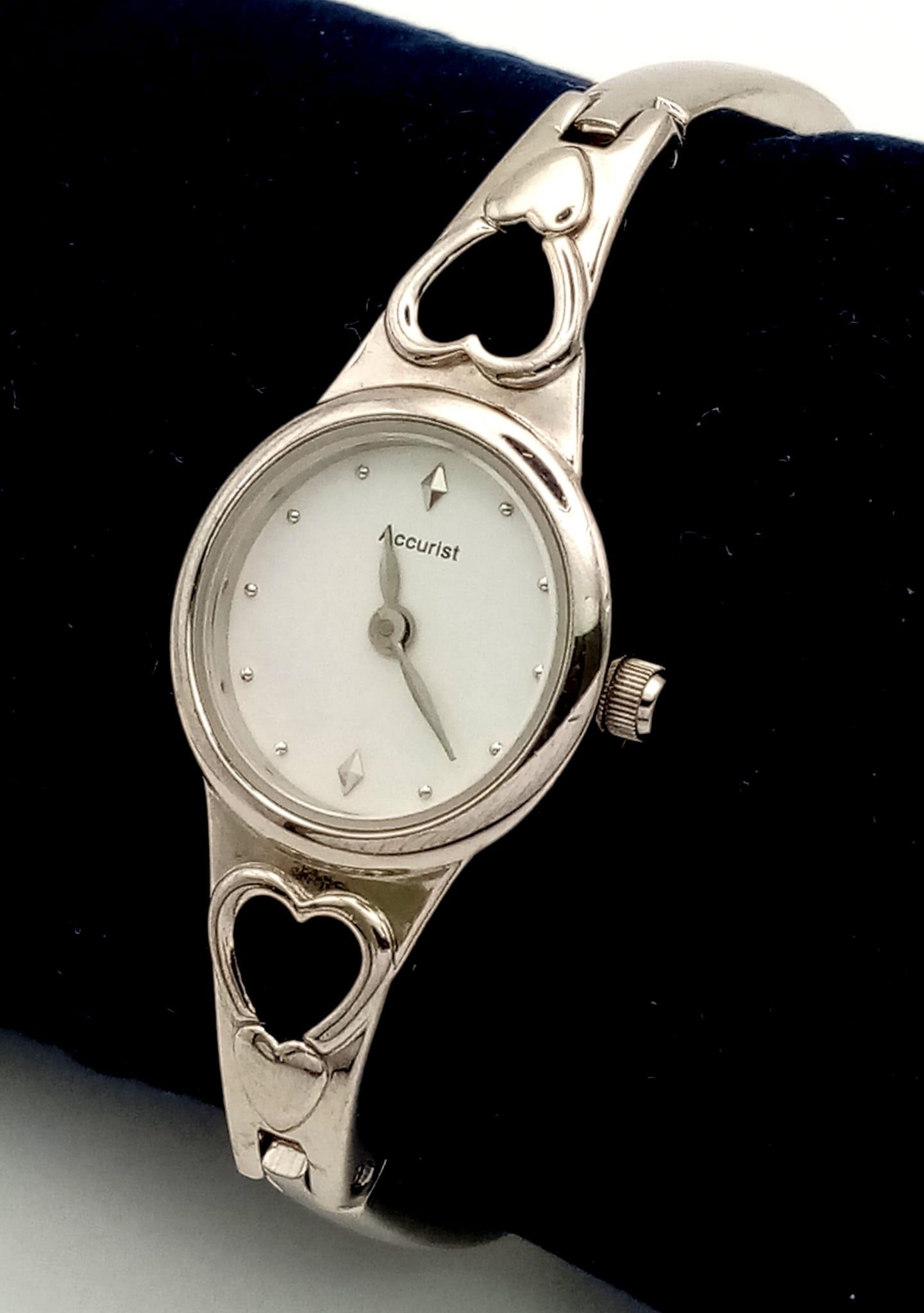 An ACCURIST stainless steel, ladies, watch. Case width: 18 mm, white dial, in full working order and