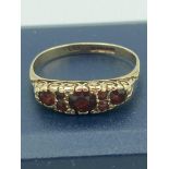9 carat GOLD RING set with cushion cut GARNETS to top in ornate mount. Full UK hallmark. Complete