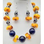 A butterscotch amber and lapis lazuli, Tibetan silver, chunky necklace and earrings set. Necklace
