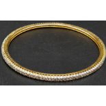 A 21K GOLD DIAMOND EDGED SLAVE BANGLE (NEEDS POLISHING) 12.8gms