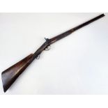 An Antique Black Powder 14 Gauge Shotgun. Made by T. Conway, this muzzle loading single shot